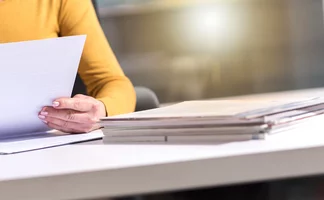 Person reviewing documents Person reviewing documents