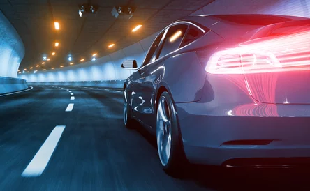 Plug-in electric vehicle with glow and motion blur and red light trails 3d rendering