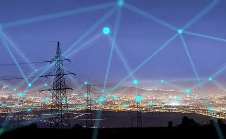 High power electricity poles in urban area connected to smart grid. Energy supply, distribution of energy, transmitting energy, energy transmission, high voltage supply concept photo.