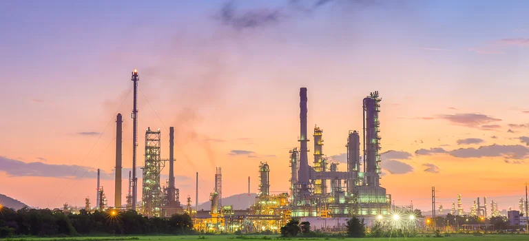 Oil refinery in petrochemical industry with sunset time